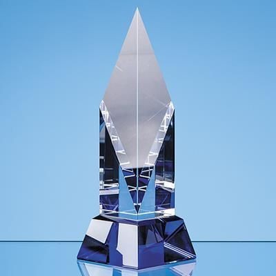 CLEAR TRANSPARENT OPTICAL CRYSTAL DIAMOND MOUNTED ON a COBALT BLUE BASE